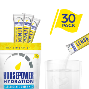 Horsepower Hydration Electrolyte Drink Mix packaging with lemon flavor, 30 pack, and a glass of water.