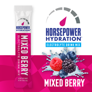 Horsepower Hydration Mixed Berry electrolyte drink mix shown as a single stick pack on the left and the product branding with berry graphics on the right, on a white and bright pink background.