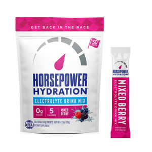 A bag of Horsepower Hydration Electrolyte Drink Mix in mixed berry flavor, shown next to a single-serve stick pack on a plain white background.